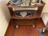 a small table with a dog statue on top of it