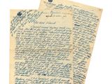 une lettre écrite à l'encre bleue sur une feuille de papier