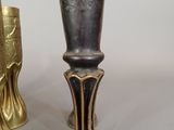 two vases sitting next to each other on a table