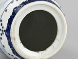 an image of a blue and white vase sitting on a table