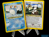 deux cartes Pokémon exposées sur une table