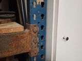 a picture of a metal shelf with a bunch of wood