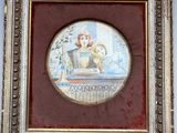 an old picture of a woman in a bathtub with a cat