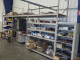 a room with a lot of shelves and boxes on it