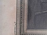 an old book with a picture of a woman sitting in a chair