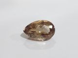 a brown diamond on a white surface