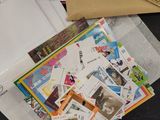 a pile of mail sitting on top of a table