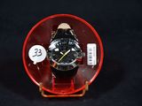 a watch in a red case on a black background
