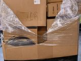 a large pile of boxes sitting on top of a pallet