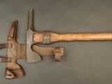 two old tools that are laying on a table