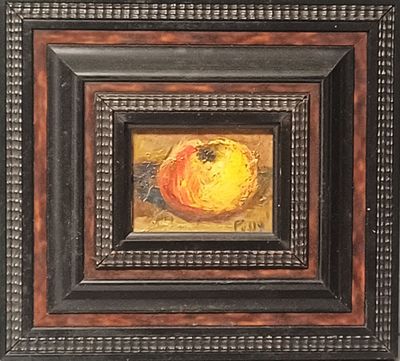 tableau représentant une pomme dans un cadre noir bordé de marron