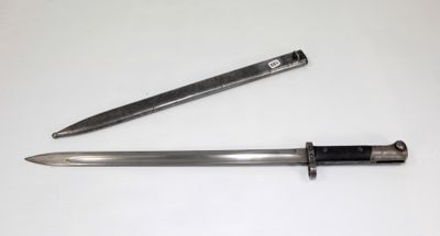 an image of a knife and a knife sharpe on a white surface
