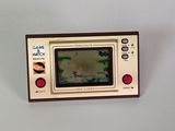 a small television set with a picture of a boat on the screen