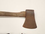 an old axe with a wooden handle next to a small axe