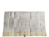 une feuille de papier portant un cachet de cire, posée sur une autre feuille de papier