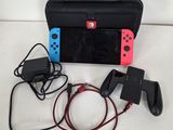 a nintendo wii game system and accessories on a table