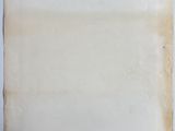 an old piece of paper on a white surface