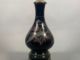 a lamp with a black base and a gold base