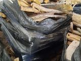 a pile of wood sitting on top of a pallet in a warehouse