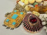 a lot of beads and jewelry on a table
