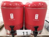 two red containers that are sitting on a counter