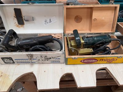 two boxes with tools on a table in a room