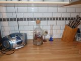 a kitchen counter with a blender, a toaster, and a toaster on it