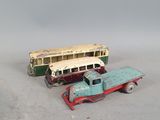two toy trucks that are sitting next to each other