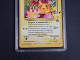 a card with a picture of a yellow pokemon character
