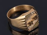 an image of a gold signet ring with an elephant on it
