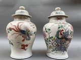 pair of chinese vases with birds and flowers painted on them