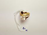 an image of a gold ring with a diamond on top of it