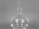 a clear glass bottle with a lot of bubbles on it