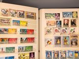 an open book with a lot of stamps on it