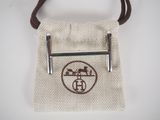 brown and white bag with a logo on it and a brown handle