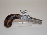 an old gun that is on display on a table