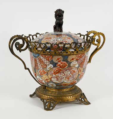 a decorative vase with a lion on it on a stand
