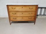an image of a wooden dresser with marble top in a room