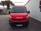 a red van that is parked in a parking lot