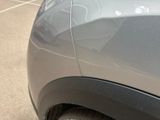a close up of a car ' s side door with a sticker on it