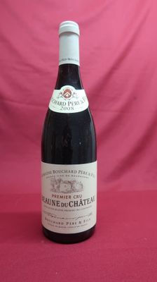 bottle of red wine on a red tablecloth with a pink background