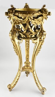 an image of a gold vase on a stand on a white background