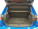 the back of a blue car with its trunk open showing the cargo area