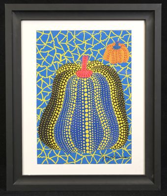 a painting of a blue and yellow cactus with a red apple on top