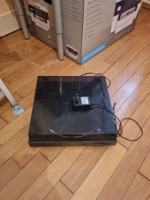 a laptop that is sitting on the floor next to a box