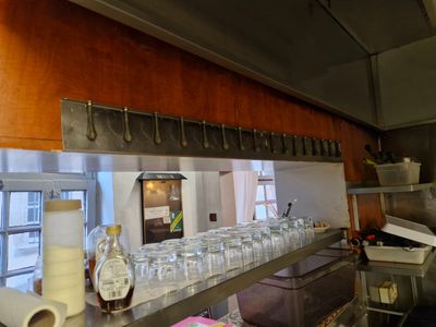 many glasses lined up on the counter in the kitchen