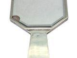 mirror on a stand with a white background and a reflection of a person in the mirror