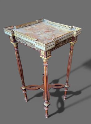 une image représentant une table avec un plateau en marbre et des pieds en bois