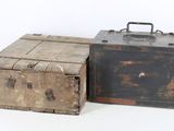 two old suitcases sitting next to each other on a white surface