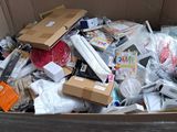 a cardboard box full of electronic devices and other items
